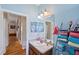 Light blue bathroom with a single sink and a large mirror at 13517 Hunters Point St, Spring Hill, FL 34609