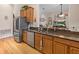 Modern kitchen with stainless steel appliances and granite countertops at 13517 Hunters Point St, Spring Hill, FL 34609