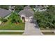Property view showcasing house, landscaping, and driveway at 13517 Hunters Point St, Spring Hill, FL 34609