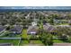 Aerial perspective of the house and surrounding neighborhood at 13517 Hunters Point St, Spring Hill, FL 34609