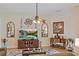 Relaxing living room featuring a large TV and hardwood floors at 13517 Hunters Point St, Spring Hill, FL 34609