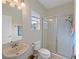 Clean bathroom with a walk-in shower and neutral colors at 13517 Hunters Point St, Spring Hill, FL 34609