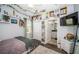 Cozy bedroom featuring built-in shelving and storage with ensuite bathroom at 10595 Marsha Dr, New Port Richey, FL 34655