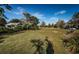 Scenic community park featuring a large grassy field with mature trees and neighborhood amenities at 10595 Marsha Dr, New Port Richey, FL 34655