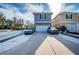 Two-car garage featuring a large driveway and a well-maintained exterior at 10595 Marsha Dr, New Port Richey, FL 34655