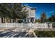 Charming two-story home featuring a white picket fence and well-maintained landscaping at 10595 Marsha Dr, New Port Richey, FL 34655
