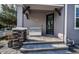 Inviting front porch with stone accents and a comfortable seating area at 10595 Marsha Dr, New Port Richey, FL 34655