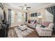 Inviting living room with hardwood floors, neutral walls, and comfortable seating at 10595 Marsha Dr, New Port Richey, FL 34655