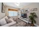 Comfortable living room with a sectional sofa, built-in shelving, and a decorative rug at 10595 Marsha Dr, New Port Richey, FL 34655