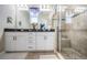 Well-appointed main bathroom with double vanity, granite countertops, and a walk-in shower at 10595 Marsha Dr, New Port Richey, FL 34655