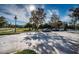 Neighborhood view with cars parked along the street near a grassy park area at 10595 Marsha Dr, New Port Richey, FL 34655