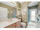 Neutral tone bathroom with a sink vanity and a shower with tub at 1717 Daylily Dr, Trinity, FL 34655