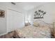 Bedroom featuring a closet, decorative wall art, and neutral tones for a relaxing atmosphere at 1717 Daylily Dr, Trinity, FL 34655