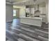 Modern kitchen with island, stainless steel appliances, and white cabinets at 19364 Sheltered Hill Dr, Brooksville, FL 34601