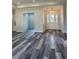 Welcoming entryway with wood-style flooring and access to an adjacent room at 19364 Sheltered Hill Dr, Brooksville, FL 34601