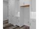 Clean white kitchen boasts ample cabinet space, subway tile backsplash, and modern luxury vinyl flooring at 19364 Sheltered Hill Dr, Brooksville, FL 34601