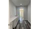 Laundry room with white cabinets, a long countertop, and stylish wood-look flooring at 19364 Sheltered Hill Dr, Brooksville, FL 34601