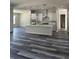 Bright kitchen boasts an island, white cabinets, and stainless steel appliances at 19364 Sheltered Hill Dr, Brooksville, FL 34601
