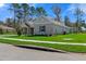 Beautiful single-story home featuring a well-maintained lawn and neutral color scheme at 19364 Sheltered Hill Dr, Brooksville, FL 34601