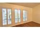 Hardwood floors and plantation shutters in bright bedroom at 6206 Soaring Ave, Temple Terrace, FL 33617