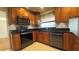 Well-equipped kitchen with stainless appliances, ample cabinet space, and stylish countertops at 6206 Soaring Ave, Temple Terrace, FL 33617