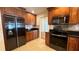 Modern kitchen with stainless steel appliances and granite countertops at 6206 Soaring Ave, Temple Terrace, FL 33617