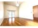 Bright and spacious living room with gleaming hardwood floors, high ceilings, and access to the outdoors at 6206 Soaring Ave, Temple Terrace, FL 33617