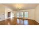 Hardwood floors, chandelier, and plantation shutters at 6206 Soaring Ave, Temple Terrace, FL 33617