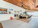 Relaxing screened patio with wooden ceiling and seating at 6206 Soaring Ave, Temple Terrace, FL 33617