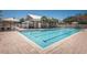 Community pool with a relaxing patio area at 10595 Marsha Dr, New Port Richey, FL 34655