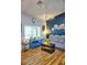 Living Room with gray couch, coffee table, and wood-look flooring at 1775 Cupecoy Cir # O4, Lutz, FL 33558
