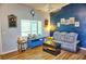 Living room with gray couch, coffee table, and wood-look flooring at 1775 Cupecoy Cir # O4, Lutz, FL 33558
