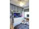 Bedroom with TV, dresser, and window coverings at 1775 Cupecoy Cir # O4, Lutz, FL 33558