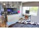 Bedroom with vanity, large TV, and wood floors at 1775 Cupecoy Cir # O4, Lutz, FL 33558