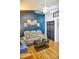 Living room with gray couch, coffee table, and wood-look flooring at 1775 Cupecoy Cir # O4, Lutz, FL 33558