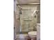 Bathroom with walk-in shower and pebble floor at 1775 Cupecoy Cir # O4, Lutz, FL 33558