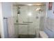 Clean bathroom with walk-in shower and tiled floor at 1775 Cupecoy Cir # O4, Lutz, FL 33558