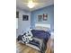 Comfortable bedroom featuring wood floors and a modern bed frame at 1775 Cupecoy Cir # O4, Lutz, FL 33558