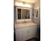 Modern bathroom with updated vanity and large mirror at 1775 Cupecoy Cir # O4, Lutz, FL 33558