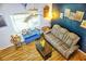 Bright living room with comfy seating and wood-look floors at 1775 Cupecoy Cir # O4, Lutz, FL 33558