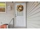 Inviting front entrance with a charming autumnal wreath at 3301 Alt 19 # 495, Palm Harbor, FL 34683