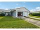 Light blue home exterior with an open garage at 8833 Manos Cir # 8833, New Port Richey, FL 34655