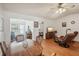 Casual dining area with a wooden table and chairs, offering a view of the kitchen and living room at 8833 Manos Cir # 8833, New Port Richey, FL 34655