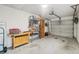 Garage with workbench and storage shelves at 8833 Manos Cir # 8833, New Port Richey, FL 34655