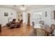 Bright dining room with a wooden table and chairs near a living room at 8833 Manos Cir # 8833, New Port Richey, FL 34655