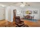 Cozy dining area with a wooden table and chairs, adjacent to a living area at 8833 Manos Cir # 8833, New Port Richey, FL 34655