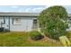 Backyard with small patio and landscaping at 8833 Manos Cir # 8833, New Port Richey, FL 34655