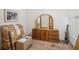 Bedroom with dresser, mirror and boxes at 8833 Manos Cir # 8833, New Port Richey, FL 34655