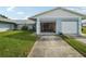 2-car garage with one door open at 8833 Manos Cir # 8833, New Port Richey, FL 34655