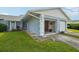 Light blue home exterior with an open garage at 8833 Manos Cir # 8833, New Port Richey, FL 34655